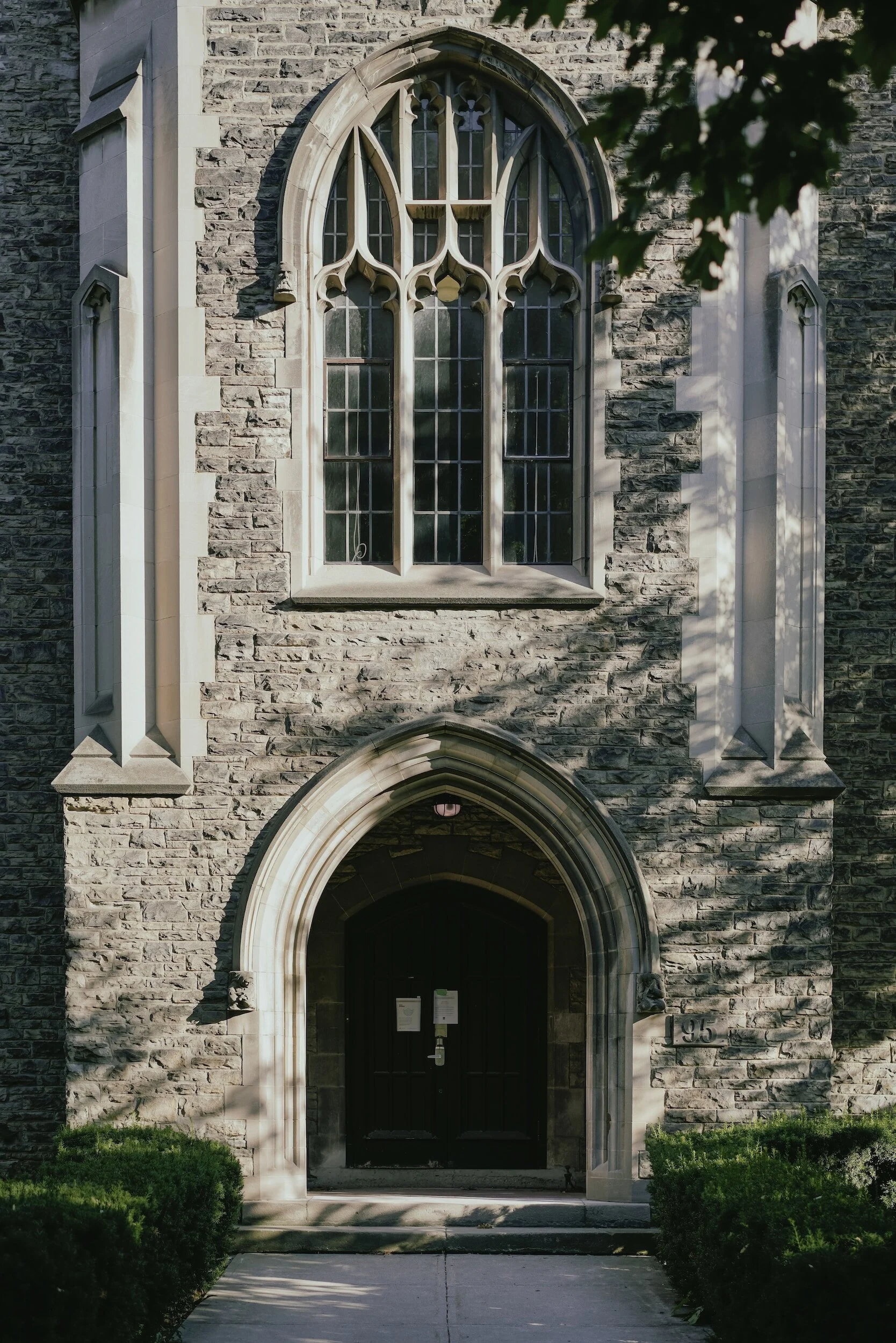 Stone Gothic entrance and arched window on the University of Toronto campus